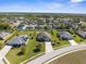 Neighborhood aerial showcasing homes with well-maintained lawns and mature trees at 1155 Buckhurst Dr, Spring Hill, FL 34609