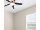 Bedroom with carpet flooring, window and ceiling fan at 1155 Buckhurst Dr, Spring Hill, FL 34609
