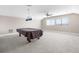 Spacious bonus room with vaulted ceilings and a billiard table ready for games at 1155 Buckhurst Dr, Spring Hill, FL 34609