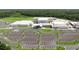 An aerial view of a well-maintained building with ample parking and landscaping at 12266 Barn Cat Run, Odessa, FL 33556