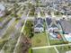 The aerial view highlights solar panels, a well-manicured backyard with a pool, and lush green lawns at 12266 Barn Cat Run, Odessa, FL 33556