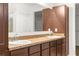 Bathroom featuring a double sink vanity and spacious mirror with ample storage at 12450 Fish Cove Dr, Spring Hill, FL 34609