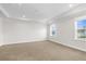 Bright and spacious bedroom with tray ceilings and ample natural light at 12450 Fish Cove Dr, Spring Hill, FL 34609