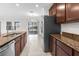 Open kitchen design featuring stainless steel appliances and granite countertops at 12450 Fish Cove Dr, Spring Hill, FL 34609