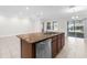 Open kitchen layout showcasing a granite island with stainless steel appliances at 12450 Fish Cove Dr, Spring Hill, FL 34609