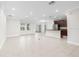 Open-concept kitchen with stainless steel appliances and a breakfast bar at 12450 Fish Cove Dr, Spring Hill, FL 34609