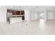 Well-lit kitchen with stainless steel appliances and a breakfast bar at 12450 Fish Cove Dr, Spring Hill, FL 34609