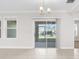 Bright living room with sliding glass doors that lead to an outdoor area at 12450 Fish Cove Dr, Spring Hill, FL 34609