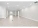 Expansive living room showcasing stylish tile flooring, recessed lighting, and an open floor plan at 12450 Fish Cove Dr, Spring Hill, FL 34609