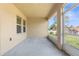 Covered patio with concrete flooring and a screened enclosure, ideal for outdoor relaxation at 12450 Fish Cove Dr, Spring Hill, FL 34609