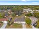 Sprawling single-story home with a long driveway and lush green surroundings in a peaceful neighborhood setting at 1313 Gatewood Ave, Spring Hill, FL 34608