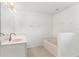 Bright bathroom featuring vanity, tub and tiled floors at 1313 Gatewood Ave, Spring Hill, FL 34608