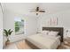 Bright bedroom with a ceiling fan, and a neutral color palette at 1313 Gatewood Ave, Spring Hill, FL 34608