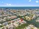 Aerial view of waterfront community, showcasing the property's canal-front location at 13820 Plumosa Ave, Hudson, FL 34667