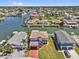 Waterfront home featuring a private dock, boat lift, and access to the Gulf of Mexico at 13820 Plumosa Ave, Hudson, FL 34667
