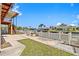 Backyard view with a canal, a white picket fence, and home at 13820 Plumosa Ave, Hudson, FL 34667