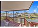 Balcony overlooking a scenic waterfront view with a boat dock at 13820 Plumosa Ave, Hudson, FL 34667