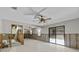 Large basement area with tile flooring and a large sliding glass door at 13820 Plumosa Ave, Hudson, FL 34667