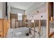Bathroom under renovation featuring a white toilet and tub at 13820 Plumosa Ave, Hudson, FL 34667