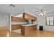 Open kitchen with stainless steel appliances and breakfast bar at 13820 Plumosa Ave, Hudson, FL 34667