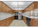 A spacious kitchen features stainless steel appliances and ample cabinet space at 13820 Plumosa Ave, Hudson, FL 34667