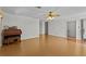 Spacious living room with hardwood floors and a ceiling fan at 13820 Plumosa Ave, Hudson, FL 34667