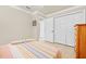 Bedroom featuring tile flooring, neutral walls, and double closets, providing ample storage space at 14471 Sterling Run, Spring Hill, FL 34609