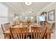 Spacious dining room featuring a large wooden table, perfect for gatherings and Gathering meals, with an open layout at 14471 Sterling Run, Spring Hill, FL 34609