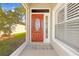 Elegant front entrance with a decorative glass door, providing a warm welcome and plenty of natural light at 14471 Sterling Run, Spring Hill, FL 34609
