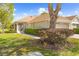 Charming single-story home featuring a well-maintained lawn and mature landscaping, creating inviting curb appeal at 14471 Sterling Run, Spring Hill, FL 34609