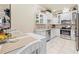 Bright kitchen features stainless steel appliances and white cabinets at 14471 Sterling Run, Spring Hill, FL 34609