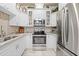 Bright kitchen features stainless steel appliances and plenty of cabinet space at 14471 Sterling Run, Spring Hill, FL 34609