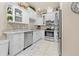 Bright kitchen features stainless steel appliances and plenty of cabinet space at 14471 Sterling Run, Spring Hill, FL 34609