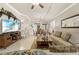 Open-concept living room featuring tile floors, neutral paint and a ceiling fan at 14471 Sterling Run, Spring Hill, FL 34609