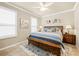 Main bedroom featuring a large bed, plantation shutters, and stylish decor, creating a relaxing atmosphere at 14471 Sterling Run, Spring Hill, FL 34609