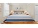 Serene main bedroom with a large bed, neutral tones, and tasteful decorations, creating a calming retreat at 14471 Sterling Run, Spring Hill, FL 34609
