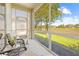 Screened-in lanai features a beautiful green view and plenty of natural light at 14471 Sterling Run, Spring Hill, FL 34609