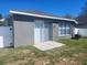 Backyard with a cement patio and a sliding door entry at 14656 Wake Robin Dr, Brooksville, FL 34604