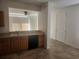 Functional kitchen features tile flooring, dishwasher, and light wood cabinetry at 14656 Wake Robin Dr, Brooksville, FL 34604