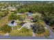 Aerial view showcasing well-maintained homes with pools and beautiful landscaping in a desirable neighborhood at 15193 Copeland Way, Brooksville, FL 34604