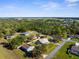 Community aerial shot showcasing homes, lush green spaces, and neighborhood streets at 15193 Copeland Way, Brooksville, FL 34604