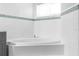 Bright bathroom featuring a large soaking tub with decorative tile accents at 15193 Copeland Way, Brooksville, FL 34604