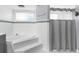 Nicely designed bathroom with a soaker tub, step-up platform, and tiled walls at 15193 Copeland Way, Brooksville, FL 34604