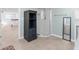 Bright bathroom featuring a glass shower, storage cabinet, and neutral tile flooring at 15193 Copeland Way, Brooksville, FL 34604