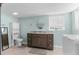 Bathroom featuring modern vanity, neutral tile floor, mirror, and toilet at 15193 Copeland Way, Brooksville, FL 34604