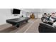 Spacious basement game room with a pool table, TV, and large seating area at 15193 Copeland Way, Brooksville, FL 34604