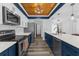 Updated kitchen offers stainless appliances, subway tile backsplash and wood-look floors at 15193 Copeland Way, Brooksville, FL 34604