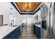 Modern kitchen boasts stylish blue cabinets, marble countertops and stainless-steel appliances at 15193 Copeland Way, Brooksville, FL 34604