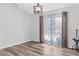 Bright room with modern wood-look flooring with natural light and modern accents at 15193 Copeland Way, Brooksville, FL 34604