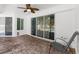 The patio features brick floors, a fan, and sliding glass doors leading to the pool at 15193 Copeland Way, Brooksville, FL 34604